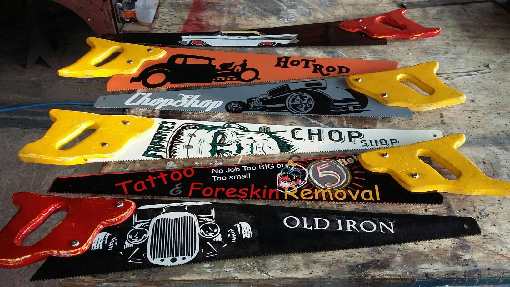Custom painted saw blade signs with hot rod and workshop themes