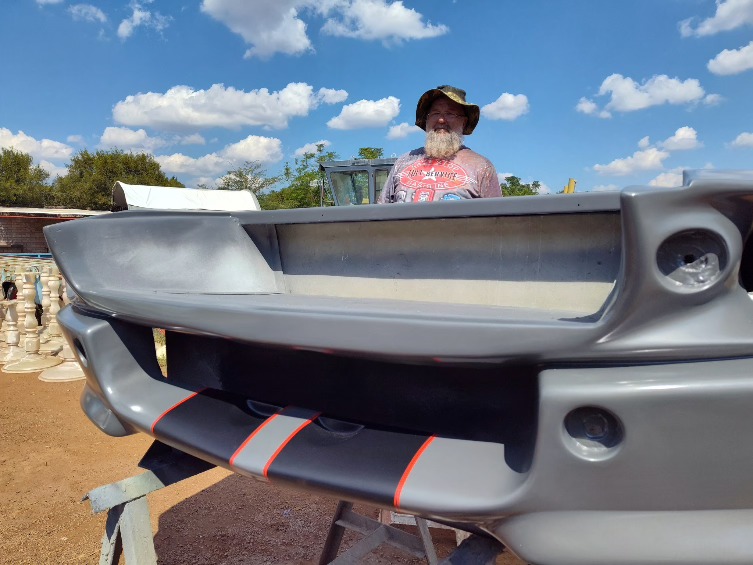 Fiberglass vehicle front panel in progress outdoors